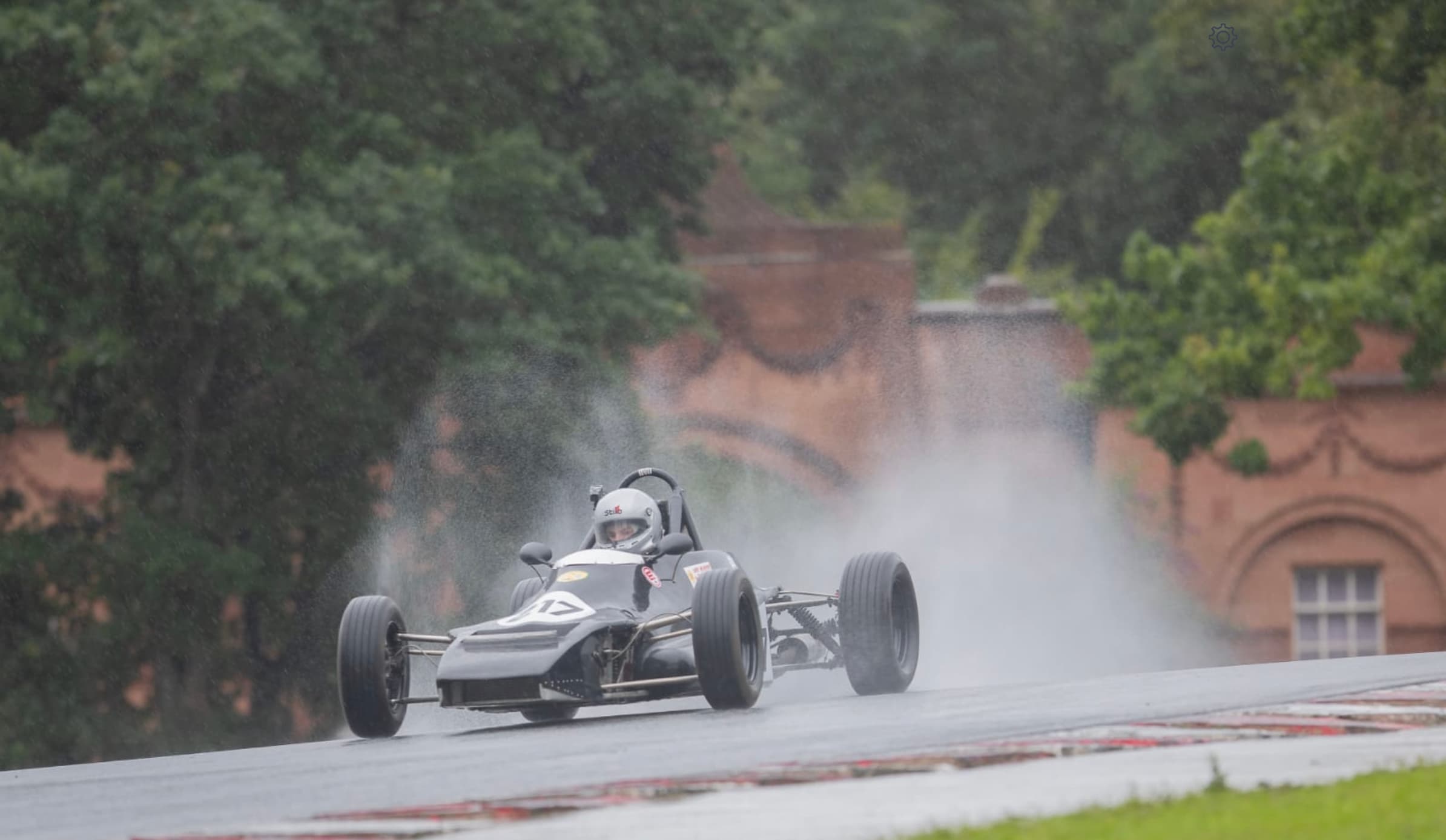 Formula Ford cresting the rise in heavy rain, 2020